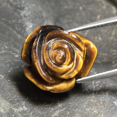 Tiger's Eye طبيعي بلون بني ذهبي، وزن ‎10.21‎ قيراط، شكل قطع زهرة، مقاس ‎16x14.9‎ مم