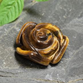 Tiger's Eye طبيعي بلون بنى دافئ، وزن ‎10.74‎ قيراط، شكل قطع زهرة، مقاس ‎15.3x15.2‎ مم
