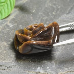 Tiger's Eye طبيعي بلون بنى دافئ، وزن ‎10.74‎ قيراط، شكل قطع زهرة، مقاس ‎15.3x15.2‎ مم