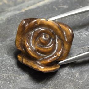 Tiger's Eye طبيعي بلون بنى دافئ، وزن ‎12.09‎ قيراط، شكل قطع زهرة، مقاس ‎16.3x16.2‎ مم