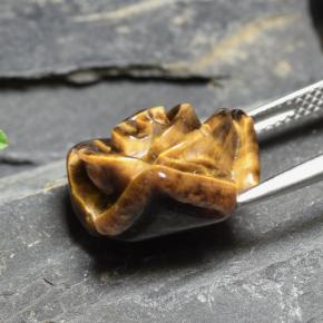 Tiger's Eye طبيعي بلون بنى متوسط، وزن ‎10.88‎ قيراط، شكل قطع زهرة، مقاس ‎15.7x15.1‎ مم