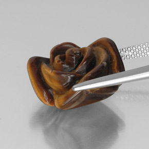 Tiger's Eye طبيعي بلون بني ذهبي، وزن ‎9.94‎ قيراط، شكل شكل خيالي، مقاس ‎15.2x14.7‎ مم