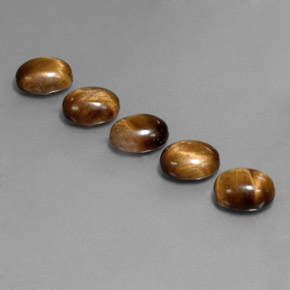 Tiger's Eye طبيعي بلون بني ذهبي، وزن ‎‎ قيراط، شكل بيضاوى، مقاس ‎9x7‎ مم