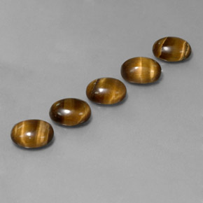 Tiger's Eye طبيعي بلون بني ذهبي، وزن ‎‎ قيراط، شكل بيضاوى، مقاس ‎8.8x6.8‎ مم