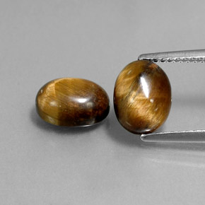 Tiger's Eye طبيعي بلون بني ذهبي، وزن ‎‎ قيراط، شكل بيضاوى، مقاس ‎9x6.9‎ مم