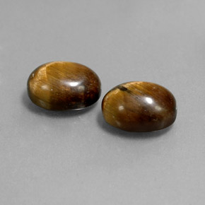 Tiger's Eye طبيعي بلون بني ذهبي، وزن ‎‎ قيراط، شكل بيضاوى، مقاس ‎9x6.9‎ مم