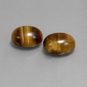 Tiger's Eye طبيعي بلون بني ذهبي، وزن ‎‎ قيراط، شكل بيضاوى، مقاس ‎9x7‎ مم