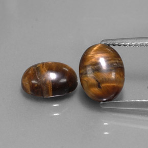 Tiger's Eye طبيعي بلون بني ذهبي، وزن ‎‎ قيراط، شكل بيضاوى، مقاس ‎8.8x6.9‎ مم