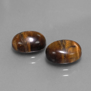 Tiger's Eye طبيعي بلون بني ذهبي، وزن ‎‎ قيراط، شكل بيضاوى، مقاس ‎8.8x6.9‎ مم