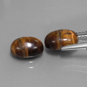 Tiger's Eye طبيعي بلون بني ذهبي، وزن ‎‎ قيراط، شكل بيضاوى، مقاس ‎8.8x6.9‎ مم