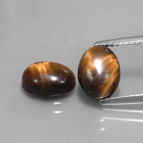 Tiger's Eye طبيعي بلون بني ذهبي، وزن ‎‎ قيراط، شكل بيضاوى، مقاس ‎8.8x6.9‎ مم