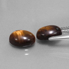 Tiger's Eye طبيعي بلون بني ذهبي، وزن ‎‎ قيراط، شكل بيضاوى، مقاس ‎8.8x6.9‎ مم