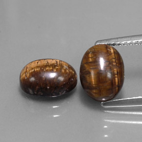 Tiger's Eye طبيعي بلون بني ذهبي، وزن ‎‎ قيراط، شكل بيضاوى، مقاس ‎9x7‎ مم