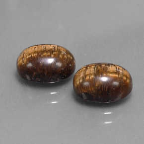 Tiger's Eye طبيعي بلون بني ذهبي، وزن ‎‎ قيراط، شكل بيضاوى، مقاس ‎9x7‎ مم