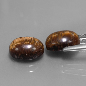 Tiger's Eye طبيعي بلون بني ذهبي، وزن ‎‎ قيراط، شكل بيضاوى، مقاس ‎9x7‎ مم