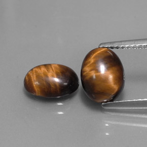 Tiger's Eye طبيعي بلون بني ذهبي، وزن ‎‎ قيراط، شكل بيضاوى، مقاس ‎8.8x6.9‎ مم