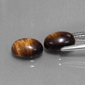 Tiger's Eye طبيعي بلون بني ذهبي، وزن ‎‎ قيراط، شكل بيضاوى، مقاس ‎8.8x6.9‎ مم