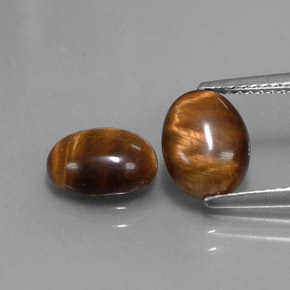 Tiger's Eye طبيعي بلون بني ذهبي، وزن ‎‎ قيراط، شكل بيضاوى، مقاس ‎9x7‎ مم