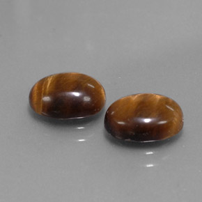 Tiger's Eye طبيعي بلون بني ذهبي، وزن ‎‎ قيراط، شكل بيضاوى، مقاس ‎9x7‎ مم