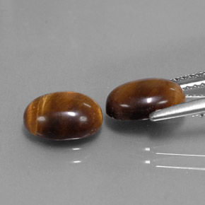 Tiger's Eye طبيعي بلون بني ذهبي، وزن ‎‎ قيراط، شكل بيضاوى، مقاس ‎9x7‎ مم