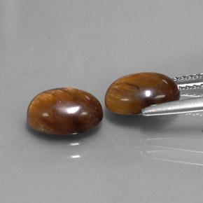 Tiger's Eye طبيعي بلون بني ذهبي، وزن ‎‎ قيراط، شكل بيضاوى، مقاس ‎8.8x6.7‎ مم