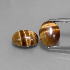 Tiger's Eye طبيعي بلون بني ذهبي، وزن ‎‎ قيراط، شكل بيضاوى، مقاس ‎8.8x6.9‎ مم
