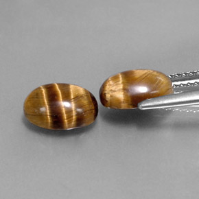 Tiger's Eye طبيعي بلون بني ذهبي، وزن ‎‎ قيراط، شكل بيضاوى، مقاس ‎8.8x6.9‎ مم