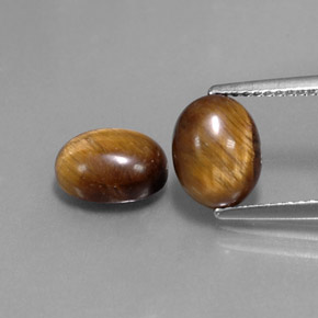 Tiger's Eye طبيعي بلون بني ذهبي، وزن ‎‎ قيراط، شكل بيضاوى، مقاس ‎9x7‎ مم