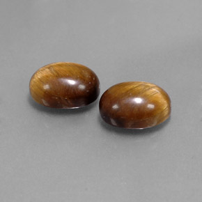 Tiger's Eye طبيعي بلون بني ذهبي، وزن ‎‎ قيراط، شكل بيضاوى، مقاس ‎9x7‎ مم