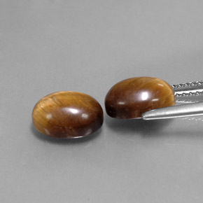 Tiger's Eye طبيعي بلون بني ذهبي، وزن ‎‎ قيراط، شكل بيضاوى، مقاس ‎9x7‎ مم