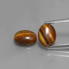 Tiger's Eye طبيعي بلون بني ذهبي، وزن ‎‎ قيراط، شكل بيضاوى، مقاس ‎8.9x6.9‎ مم