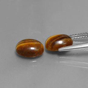 Tiger's Eye طبيعي بلون بني ذهبي، وزن ‎‎ قيراط، شكل بيضاوى، مقاس ‎8.9x6.9‎ مم