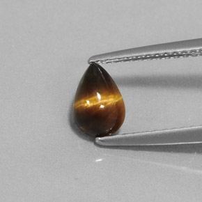 Tiger's Eye طبيعي بلون بني ذهبي، وزن ‎0.70‎ قيراط، شكل شكل الكمثرى، مقاس ‎7.2x5‎ مم