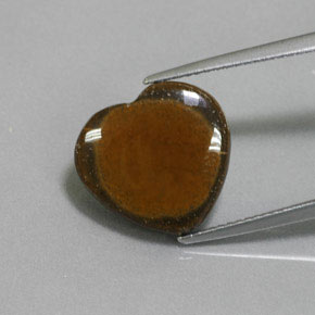 Tiger's Eye طبيعي بلون بني ذهبي، وزن ‎7.51‎ قيراط، شكل شكل القلب، مقاس ‎14.4x13.6‎ مم