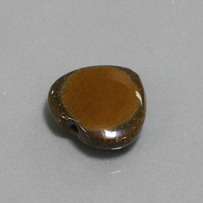 Tiger's Eye طبيعي بلون بني ذهبي، وزن ‎7.51‎ قيراط، شكل شكل القلب، مقاس ‎14.4x13.6‎ مم
