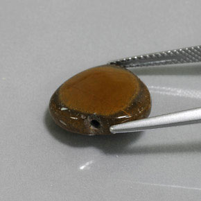 Tiger's Eye طبيعي بلون بني ذهبي، وزن ‎7.51‎ قيراط، شكل شكل القلب، مقاس ‎14.4x13.6‎ مم