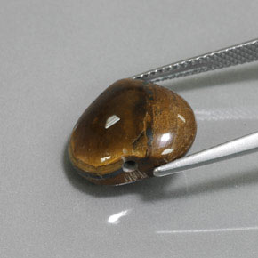 Tiger's Eye طبيعي بلون بني ذهبي، وزن ‎9.47‎ قيراط، شكل شكل القلب، مقاس ‎14.3x13.1‎ مم