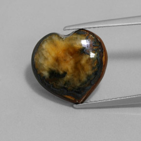 Tiger's Eye طبيعي بلون بني ذهبي، وزن ‎9.68‎ قيراط، شكل شكل القلب، مقاس ‎14.3x13.8‎ مم