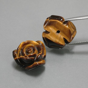 Tiger's Eye طبيعي بلون بني ذهبي، وزن ‎23.41‎ قيراط، شكل شكل خيالي، مقاس ‎16.4x15.5‎ مم
