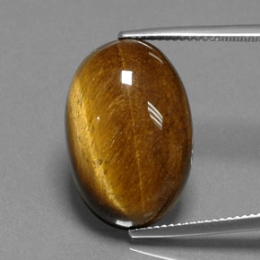 Tiger's Eye طبيعي بلون بني ذهبي، وزن ‎18.74‎ قيراط، شكل بيضاوى، مقاس ‎21.6x14.4‎ مم