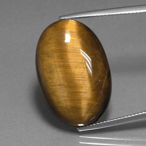Tiger's Eye طبيعي بلون بنى دافئ، وزن ‎20.98‎ قيراط، شكل بيضاوى، مقاس ‎24.8x16.6‎ مم