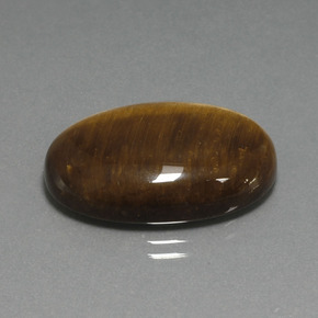 Tiger's Eye طبيعي بلون بنى دافئ، وزن ‎20.98‎ قيراط، شكل بيضاوى، مقاس ‎24.8x16.6‎ مم