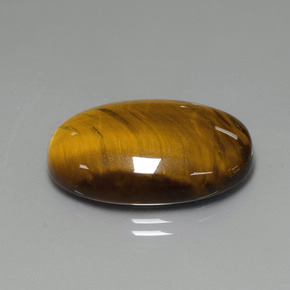 Tiger's Eye طبيعي بلون بني ذهبي، وزن ‎19.99‎ قيراط، شكل بيضاوى، مقاس ‎24.6x16.5‎ مم