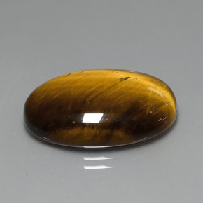 Tiger's Eye طبيعي بلون بني ذهبي، وزن ‎19.59‎ قيراط، شكل بيضاوى، مقاس ‎24.7x16.6‎ مم