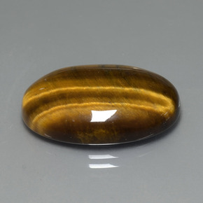 Tiger's Eye طبيعي بلون بني ذهبي، وزن ‎20.01‎ قيراط، شكل بيضاوى، مقاس ‎24.8x16.6‎ مم