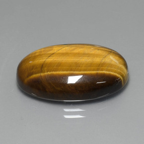 Tiger's Eye طبيعي بلون بني ذهبي، وزن ‎20.74‎ قيراط، شكل بيضاوى، مقاس ‎24.8x16.6‎ مم