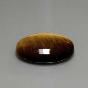 Tiger's Eye طبيعي بلون بني ذهبي، وزن ‎20.21‎ قيراط، شكل بيضاوى، مقاس ‎24.7x16.7‎ مم