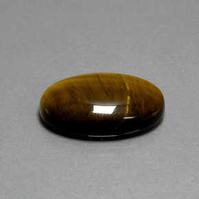 Tiger's Eye طبيعي بلون بني ذهبي، وزن ‎19.87‎ قيراط، شكل بيضاوى، مقاس ‎24.7x16.6‎ مم