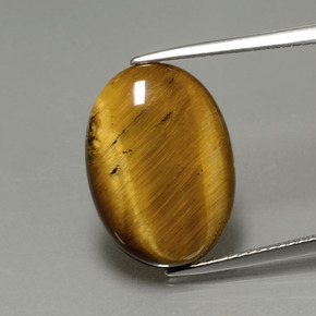 Tiger's Eye طبيعي بلون بني ذهبي، وزن ‎7.51‎ قيراط، شكل بيضاوى، مقاس ‎17.9x12.9‎ مم