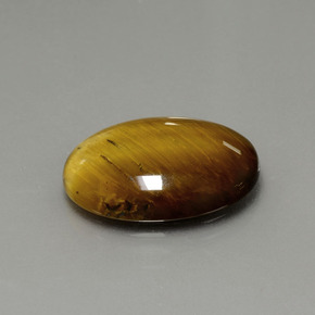 Tiger's Eye طبيعي بلون بني ذهبي، وزن ‎7.51‎ قيراط، شكل بيضاوى، مقاس ‎17.9x12.9‎ مم